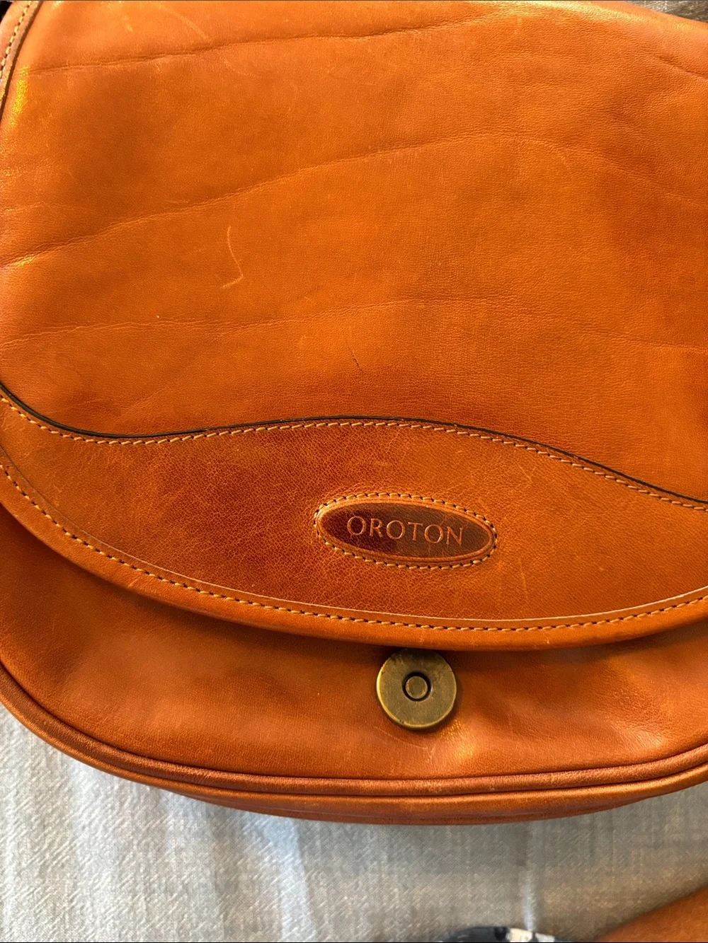 Oroton Cognac Leather crossbody Bag, zippered pocket on inside , dust bag
